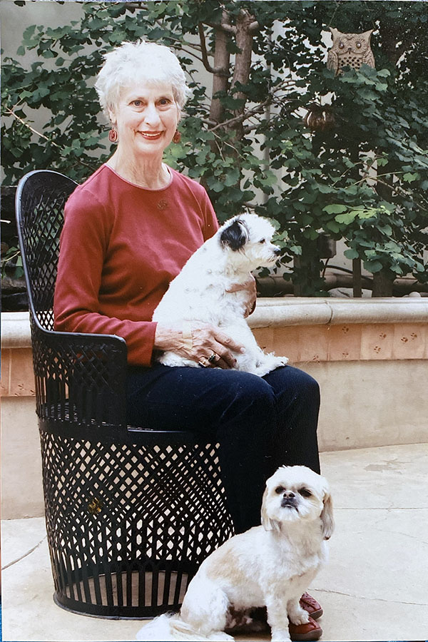 Karen Romney sits with her dogs at her Camarillo home.