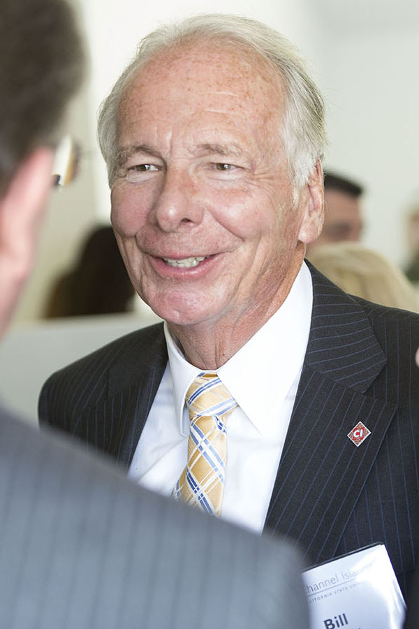 The photo shows Bill Kearney mingling at a CSUCI event.