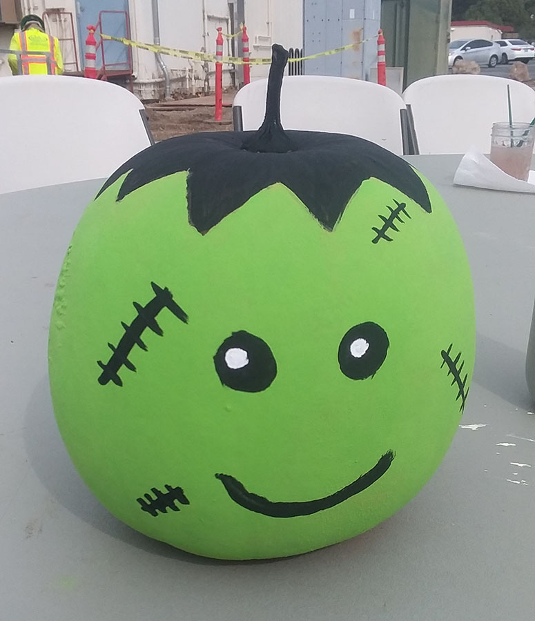 Pumpkin painted to look like friendly Frankenstein