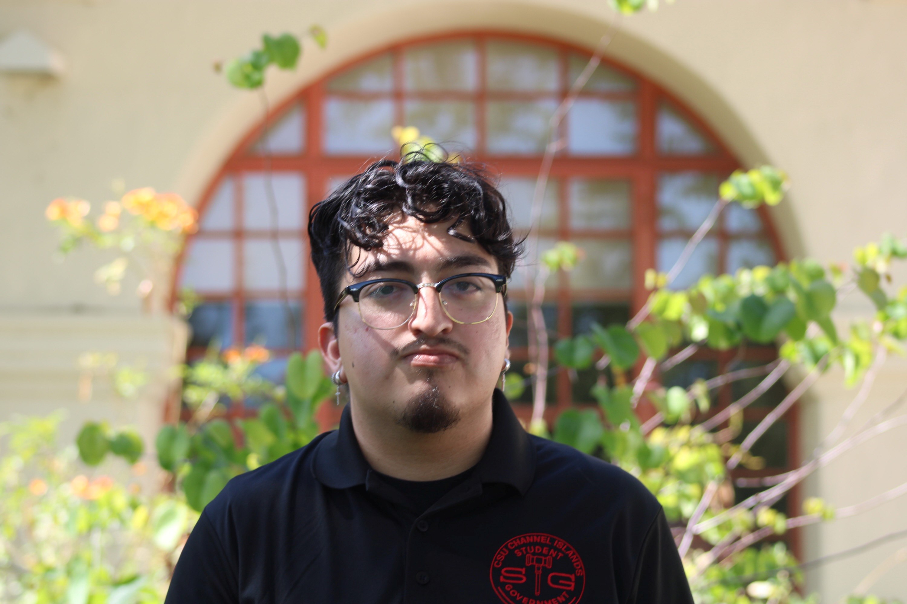 man smiling in courtyard