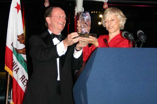 President Rush presenting Award to Linda Dullam