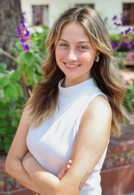 headshot of addy smiling outside