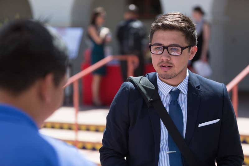 Student in a suit and tie