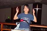 A member of the choir conducting.
