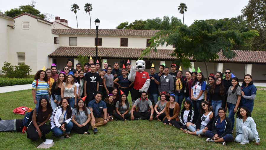 students and faculty at a birthday party
