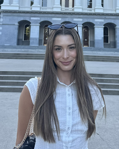 Rachel in front of a big building