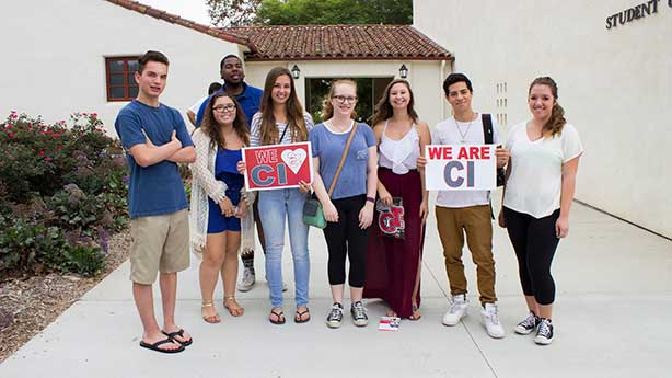 Students holding We Are CI sign